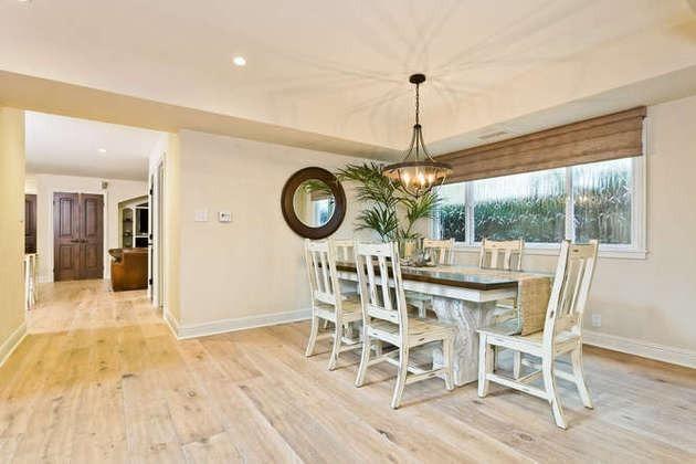1030 Mandalay Beach Road Oxnard, CA 93035 - Photo 13 of 39 a dining room with a wooden table and chairs