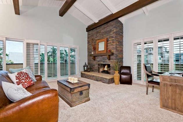 1030 Mandalay Beach Road Oxnard, CA 93035 - Photo 17 of 39 a living room with furniture large windows and a fireplace
