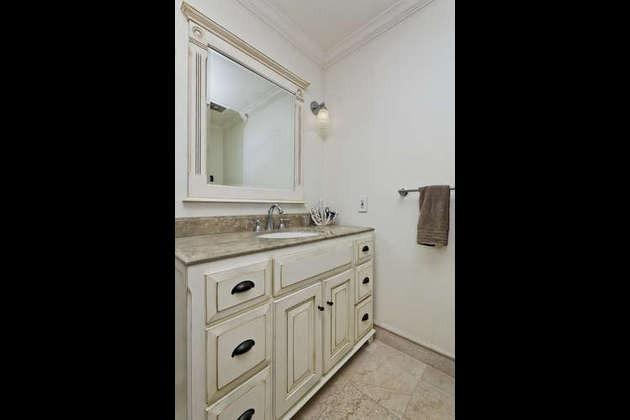 1030 Mandalay Beach Road Oxnard, CA 93035 - Photo 26 of 39 a bathroom with a granite countertop sink and a mirror