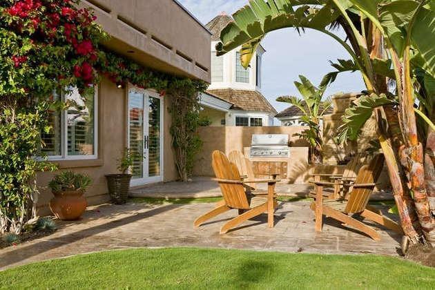 1030 Mandalay Beach Road Oxnard, CA 93035 - Photo 30 of 39 a view of a patio with table and chairs and potted plants