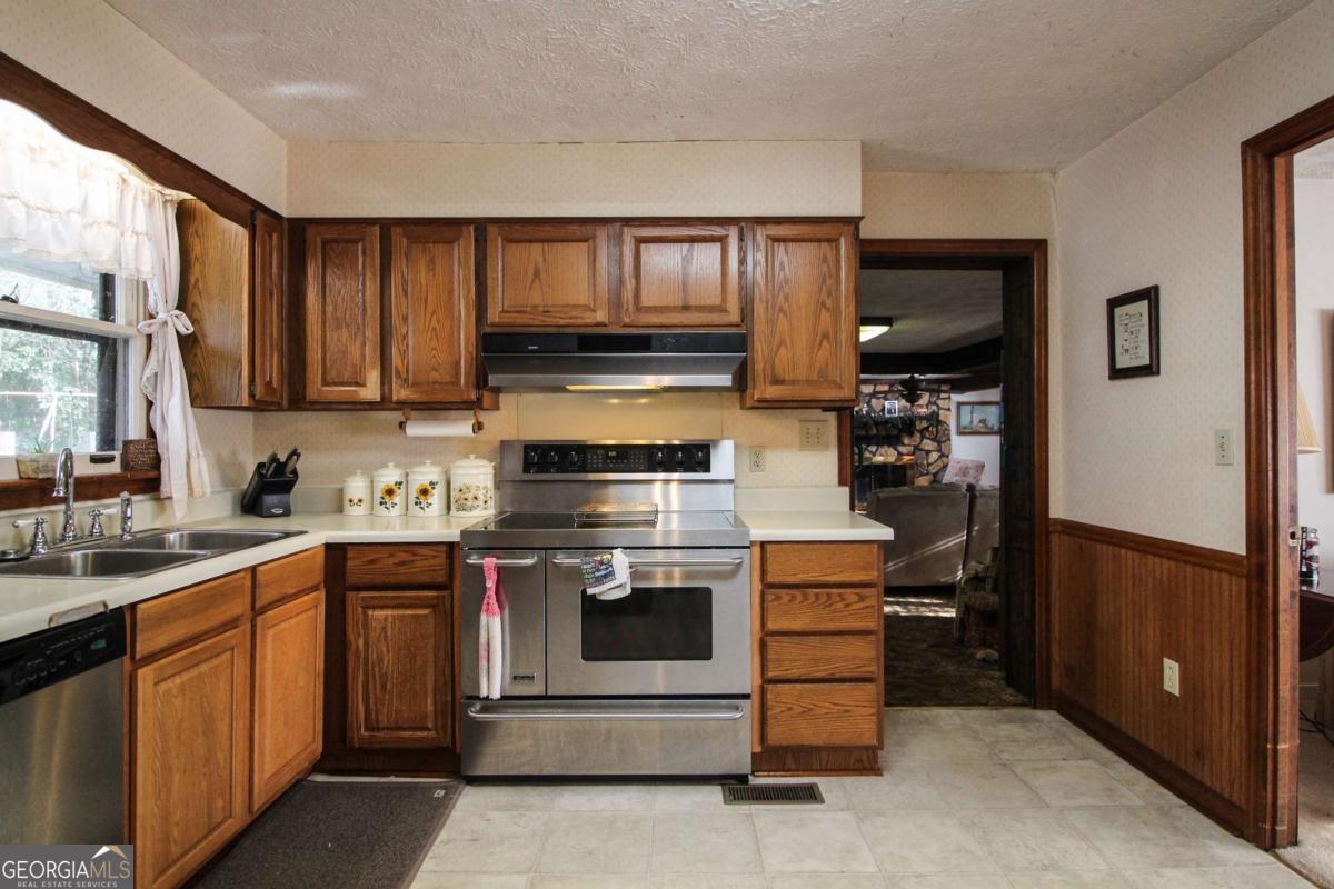 921 Highway 72 Comer, GA 30629 - Photo 12 of 55 a kitchen with a stove and a sink