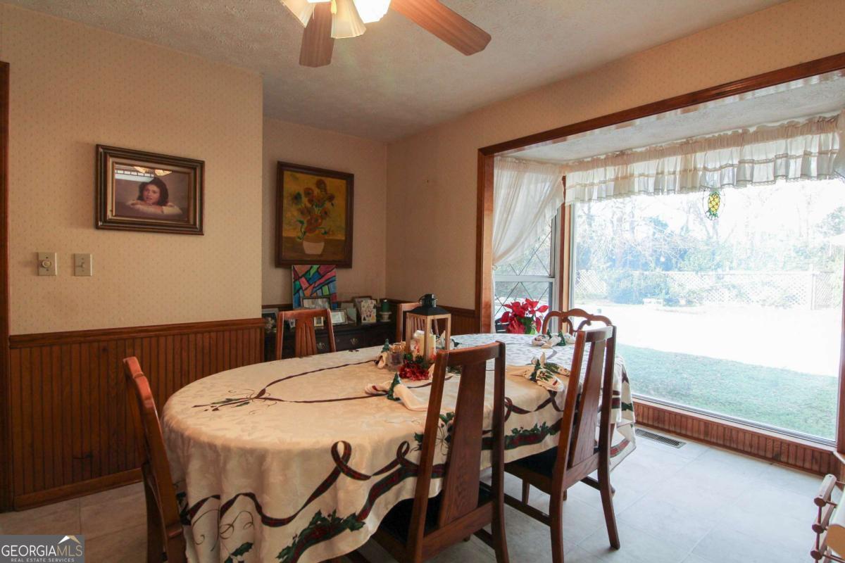 921 Highway 72 Comer, GA 30629 - Photo 14 of 55 a view of a dining room with furniture window and outside view