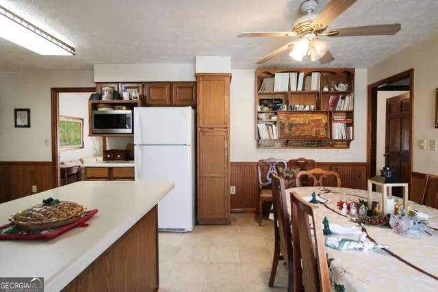 a bedroom with bed or couch and a potted plant