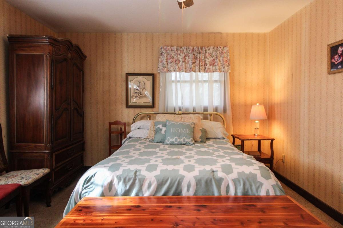 921 Highway 72 Comer, GA 30629 - Photo 22 of 55 a bedroom with a bed and wooden floor