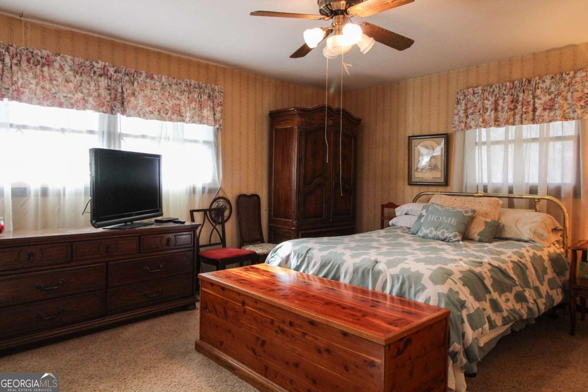 921 Highway 72 Comer, GA 30629 - Photo 23 of 55 a bedroom with a bed and a flat screen tv