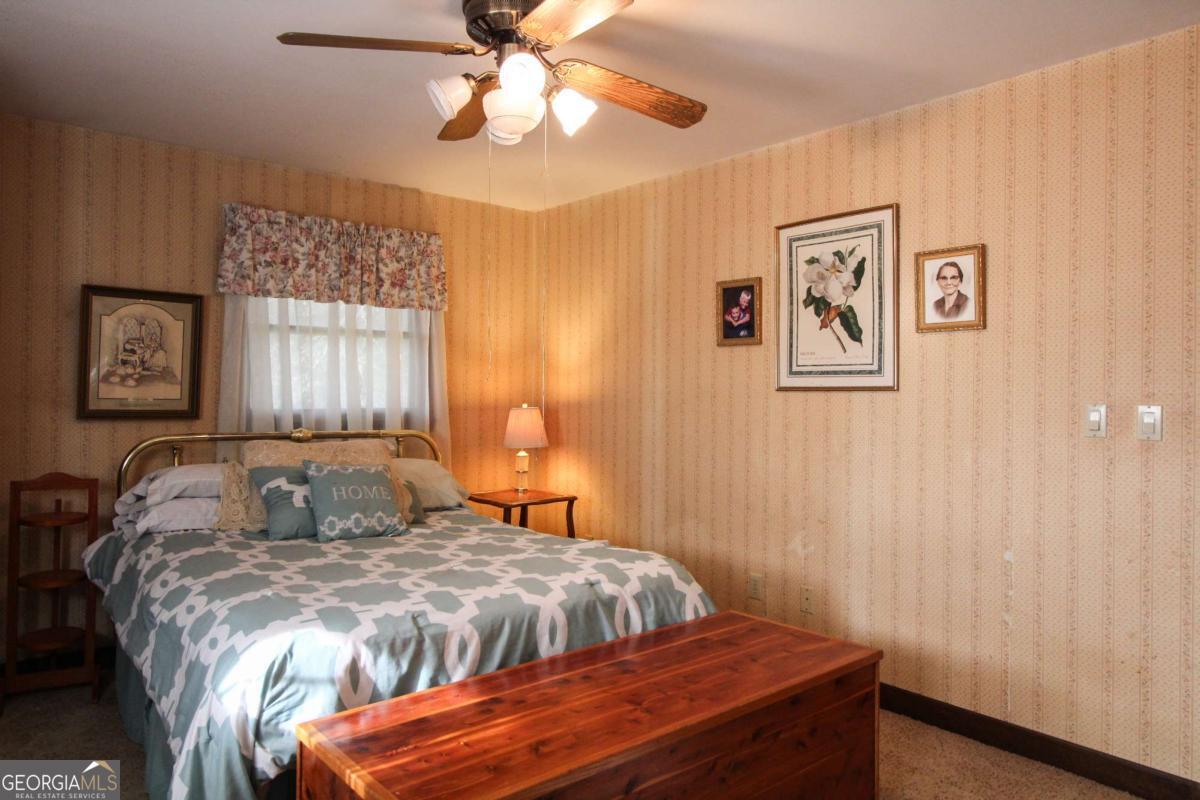 921 Highway 72 Comer, GA 30629 - Photo 24 of 55 a bedroom with a bed and a window