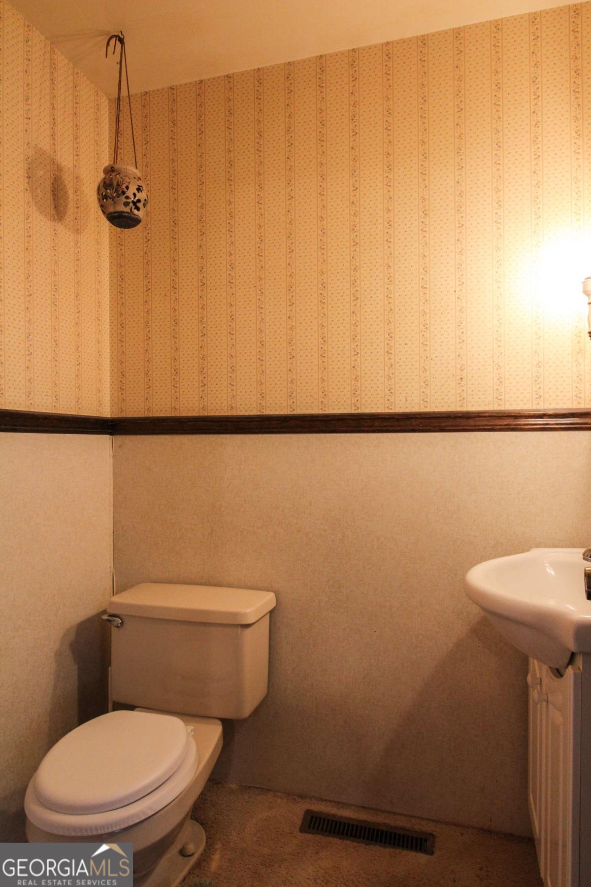 921 Highway 72 Comer, GA 30629 - Photo 27 of 55 a white toilet sitting next to a shower