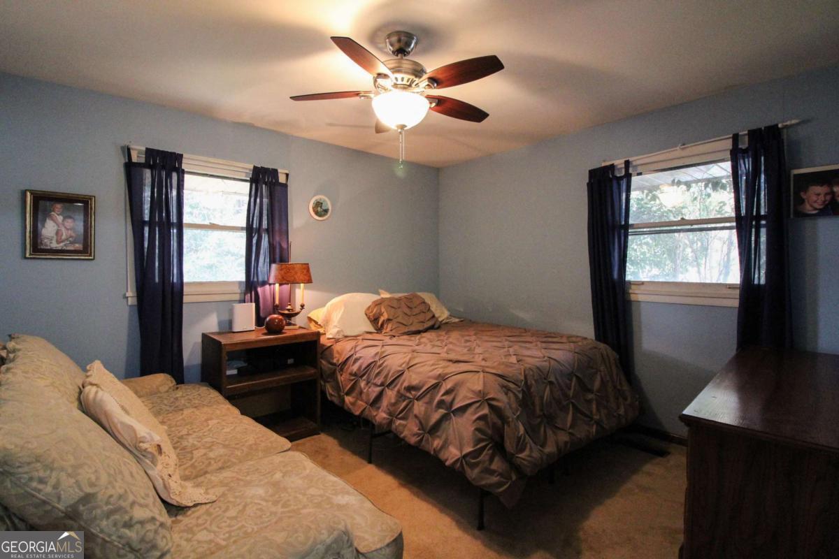 921 Highway 72 Comer, GA 30629 - Photo 29 of 55 a bedroom with two beds and a window