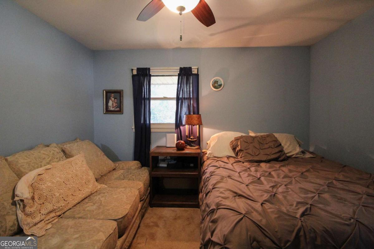 921 Highway 72 Comer, GA 30629 - Photo 30 of 55 a bedroom with a bed and window