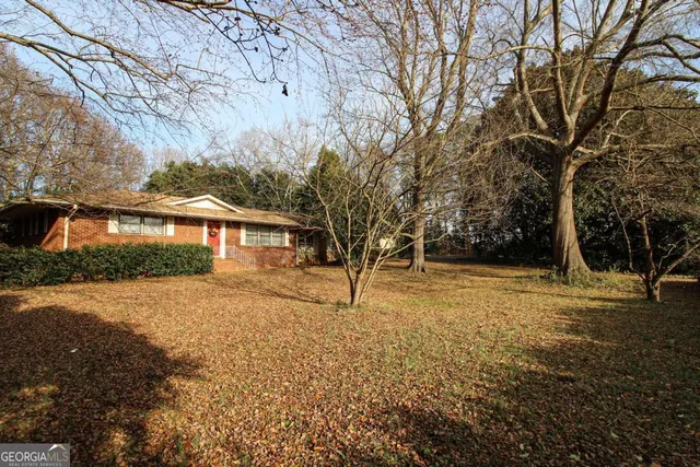 a view of house with outdoor space