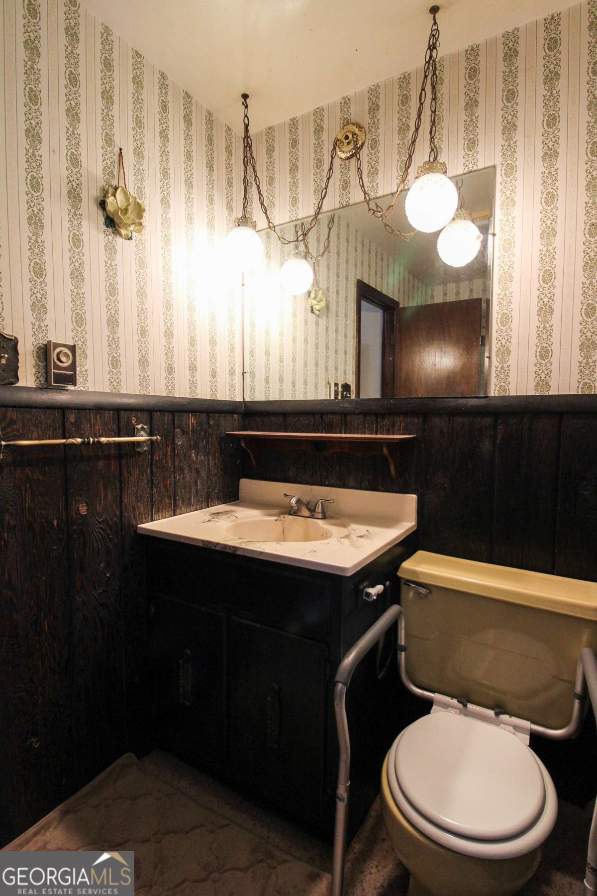 921 Highway 72 Comer, GA 30629 - Photo 33 of 55 a bathroom with a sink a toilet and a mirror