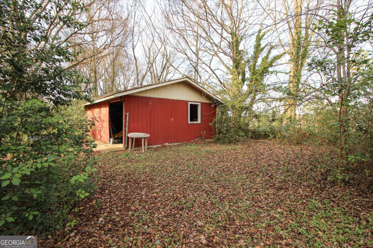 921 Highway 72 Comer, GA 30629 - Photo 47 of 55 a large tree in front of a house