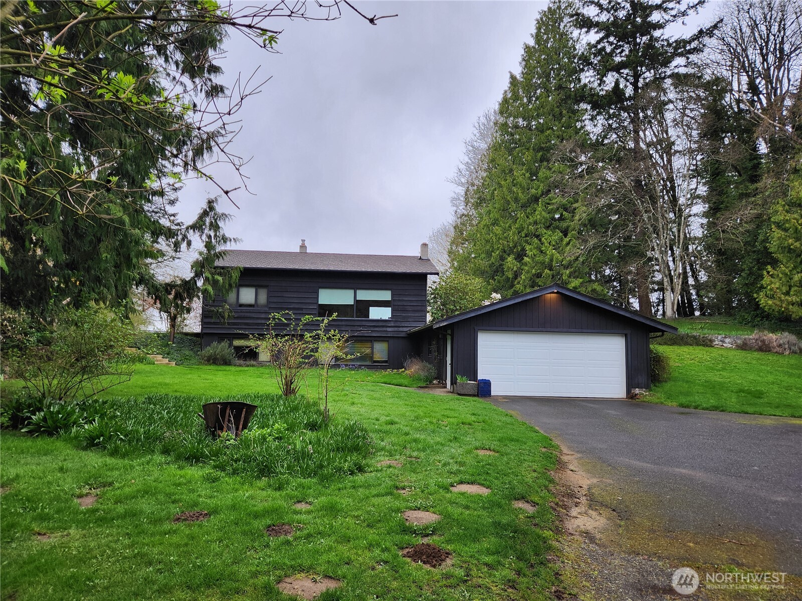 1312 Paradise Road Ferndale, WA 98248 - Photo 1 of 1 a view of a house with backyard and garden