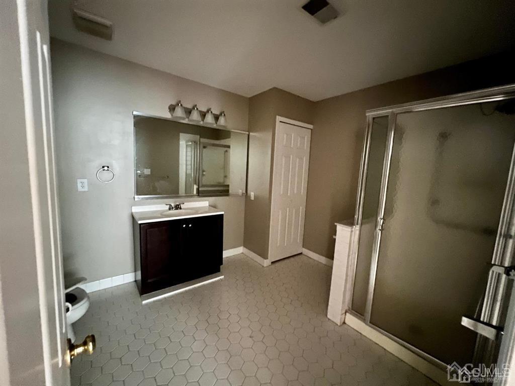 59 Winthrop Road, Unit 59A Monroe Township, NJ 08831 - Photo 11 of 13 a bathroom with a double vanity sink and mirror