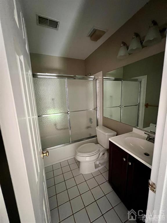 59 Winthrop Road, Unit 59A Monroe Township, NJ 08831 - Photo 12 of 13 a bathroom with a granite countertop sink toilet and shower