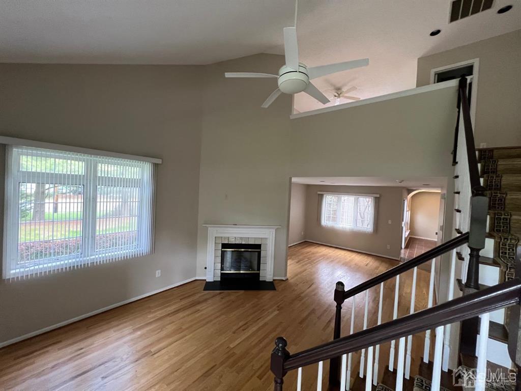 59 Winthrop Road, Unit 59A Monroe Township, NJ 08831 - Photo 3 of 13 a view of an empty room with wooden floor and a window