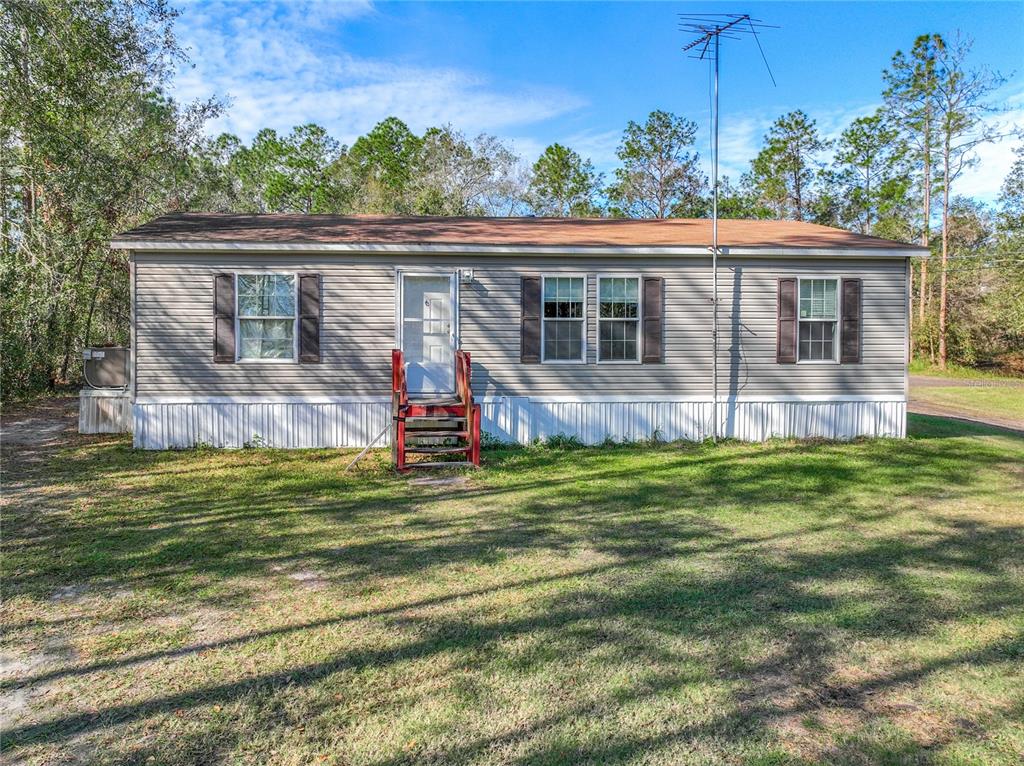 2120 Limedale Road Lakeland, FL 33809 - Photo 1 of 1 a view of a house with a backyard and a patio