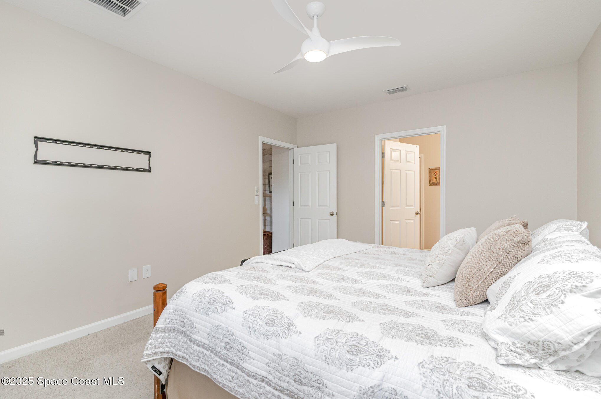 1110 Swiss Pointe Lane Rockledge, FL 32955 - Photo 14 of 26 a bedroom with a bed and a window