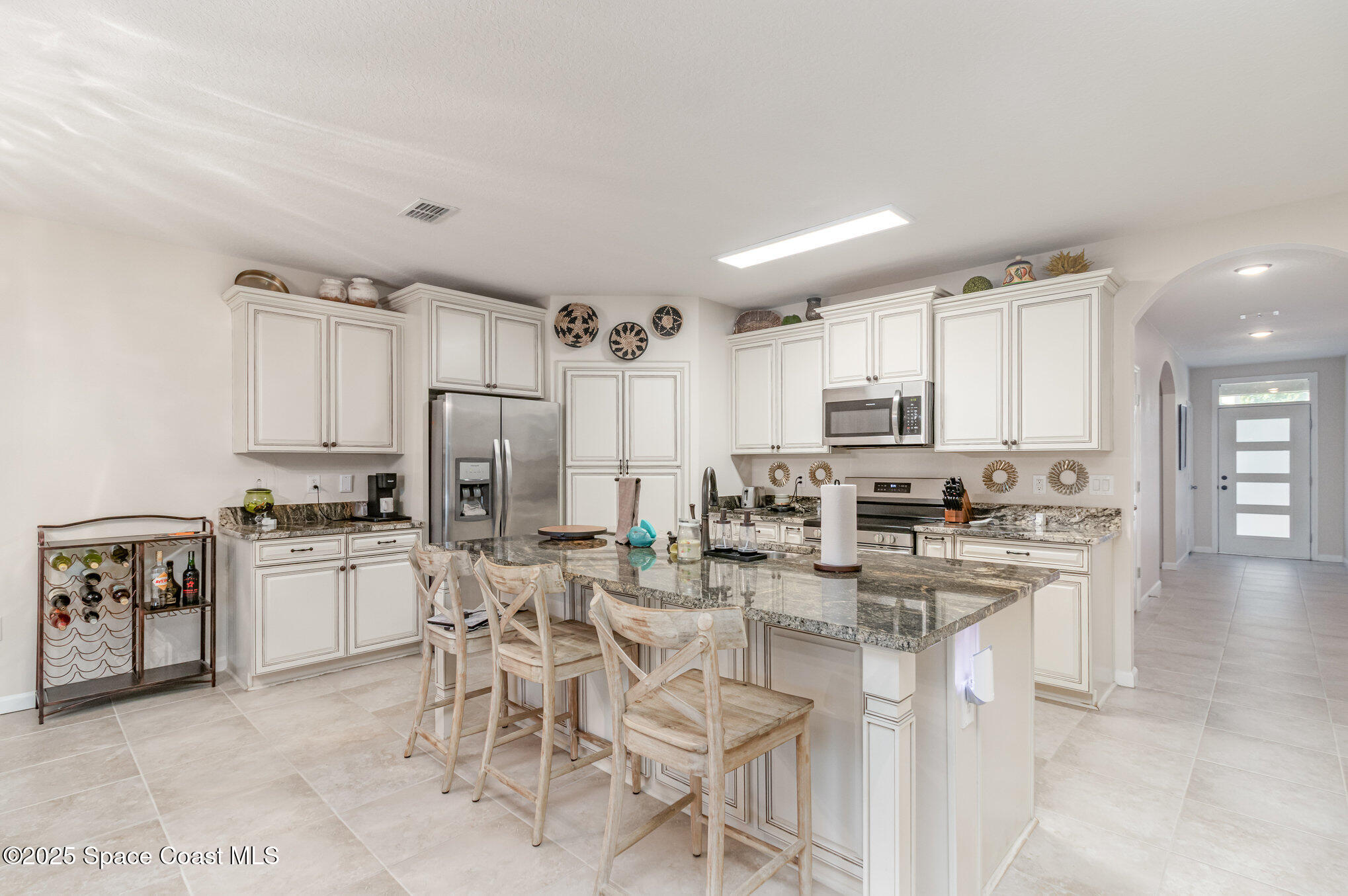 1110 Swiss Pointe Lane Rockledge, FL 32955 - Photo 5 of 26 a kitchen with appliances a sink and cabinets