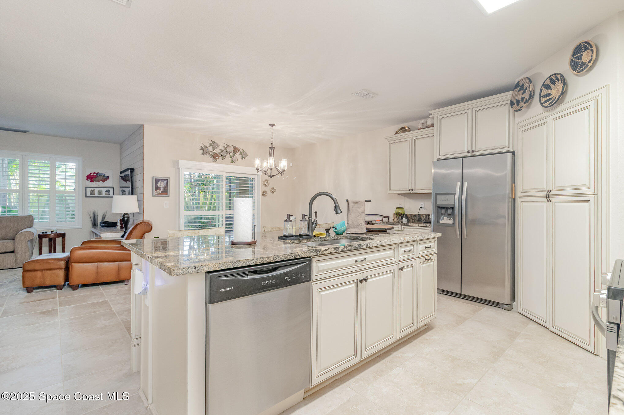 1110 Swiss Pointe Lane Rockledge, FL 32955 - Photo 6 of 26 a kitchen with refrigerator and cabinets
