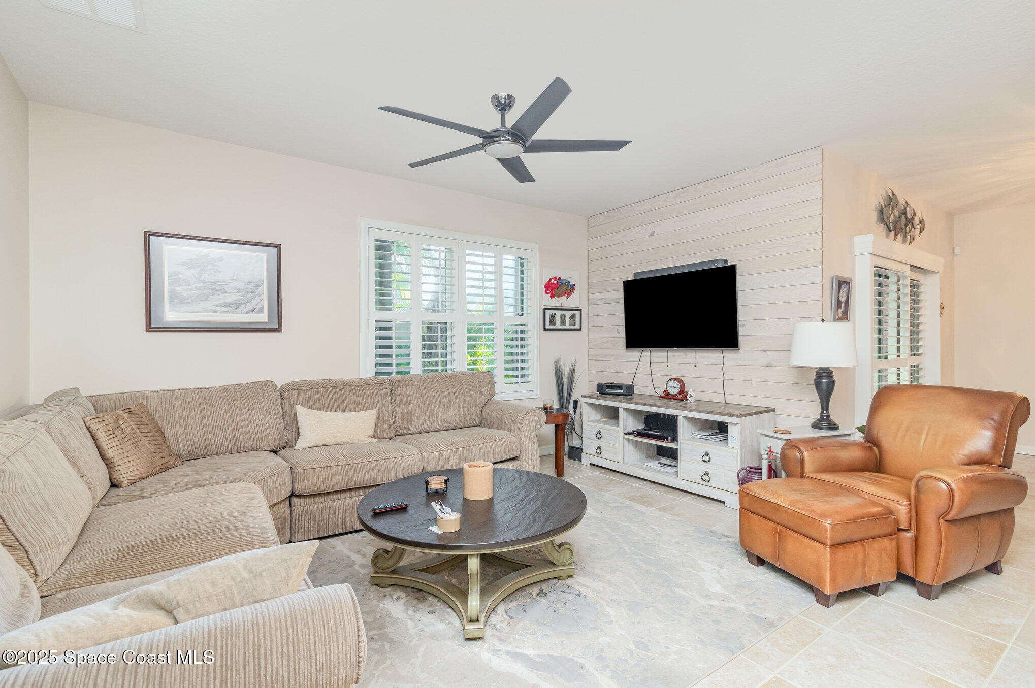 1110 Swiss Pointe Lane Rockledge, FL 32955 - Photo 9 of 26 a living room with furniture and a flat screen tv