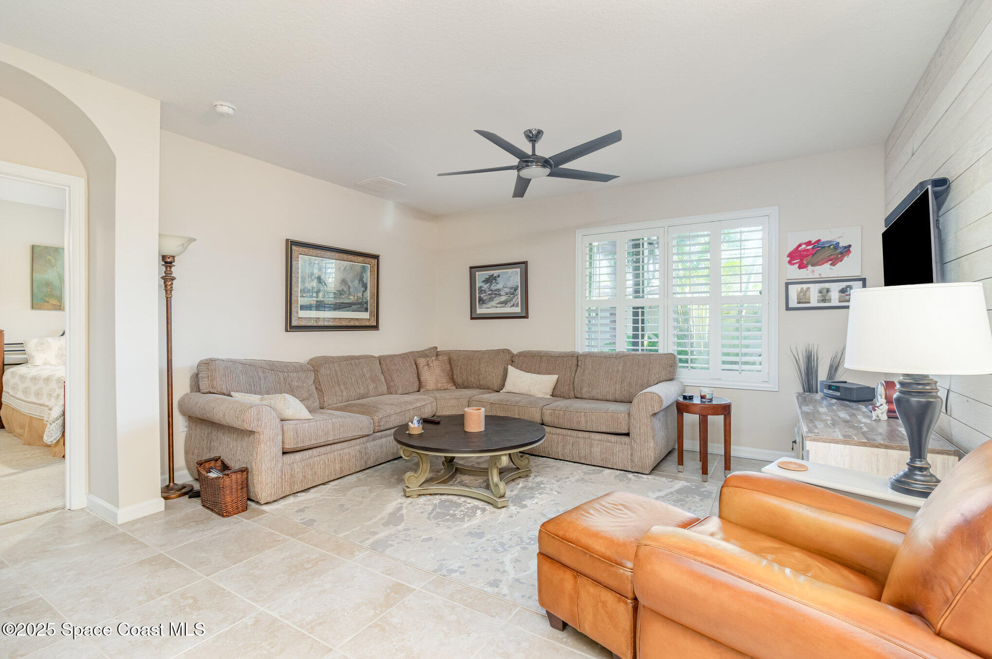 1110 Swiss Pointe Lane Rockledge, FL 32955 - Photo 10 of 26 a living room with furniture and a flat screen tv