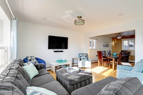a kitchen with granite countertop white cabinets stainless steel appliances and a sink