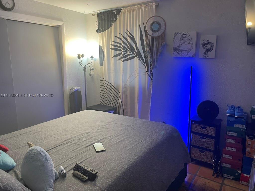 3741 Southwest 27th Terrace Miami, FL 33134 - Photo 13 of 17 a bedroom with a bed and a closet