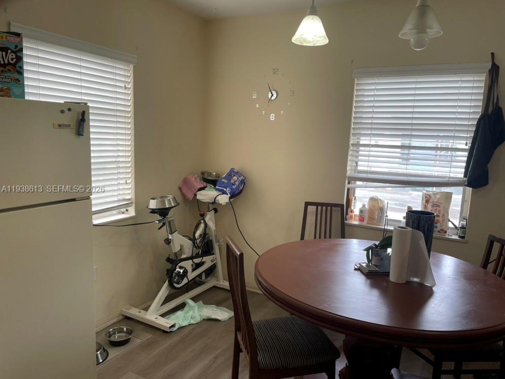 3741 Southwest 27th Terrace Miami, FL 33134 - Photo 7 of 17 a view of a dining room with furniture and window