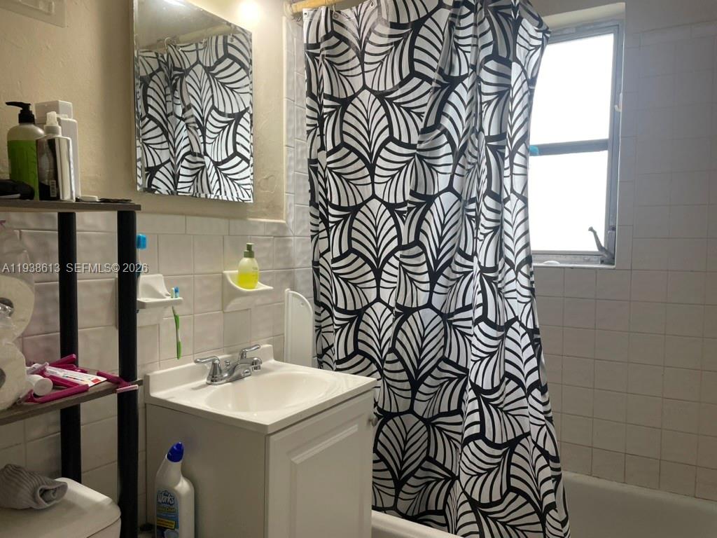 3741 Southwest 27th Terrace Miami, FL 33134 - Photo 10 of 17 a bathroom with a sink and mirror