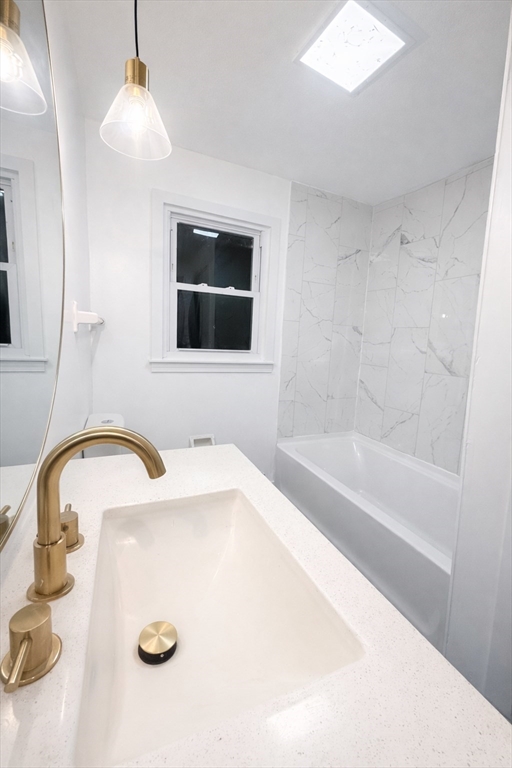 116 Breckwood Circle Springfield, MA 01119 - Photo 12 of 20 a bathroom with a tub sink and mirror