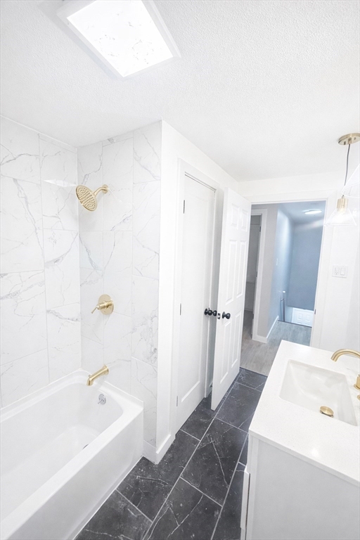 116 Breckwood Circle Springfield, MA 01119 - Photo 13 of 20 a bathroom with a bathtub a sink and a shower