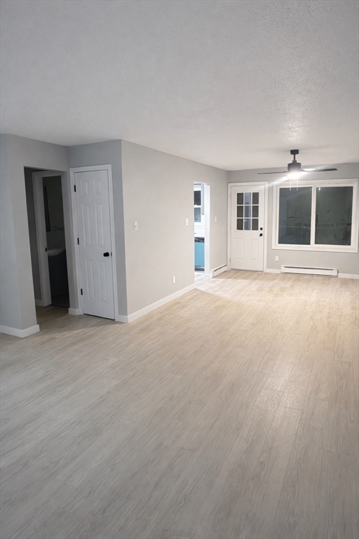 116 Breckwood Circle Springfield, MA 01119 - Photo 7 of 20 a view of empty room with windows and fireplace
