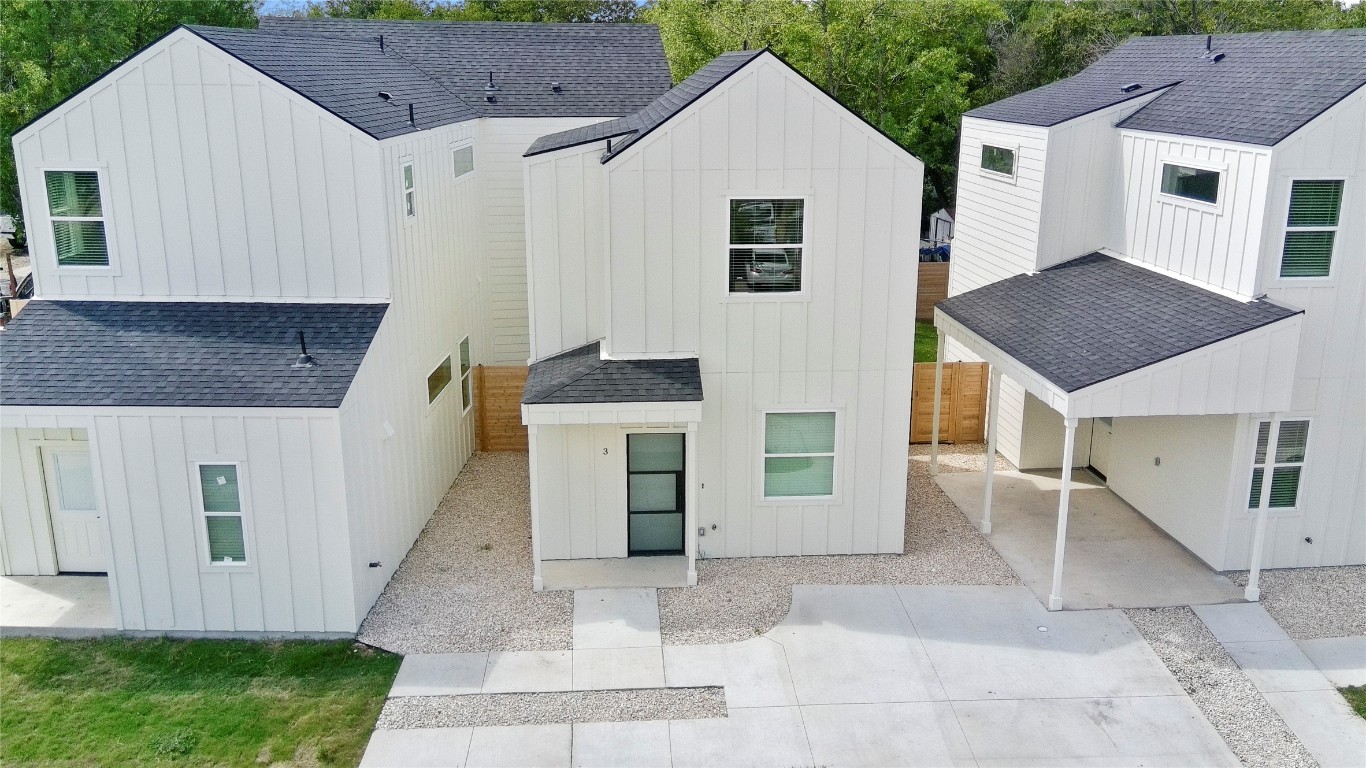 6107 Begonia Circle, Unit 3 Austin, TX 78741 - Photo 1 of 21 a view of a white house with a sink and a yard