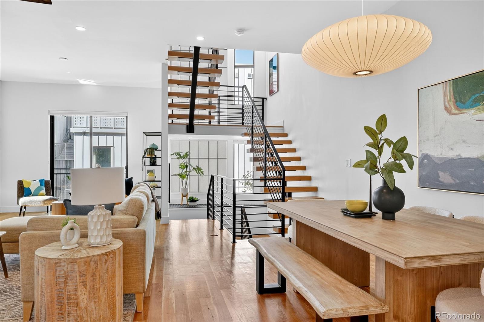1150 26th Street Denver, CO 80205 - Photo 12 of 50 a dining room with furniture and wooden floor