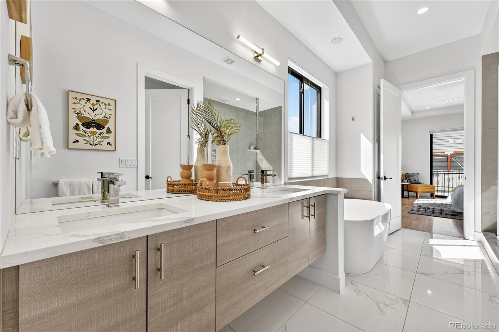 1150 26th Street Denver, CO 80205 - Photo 24 of 50 a spacious bathroom with a granite countertop sink mirror and toilet