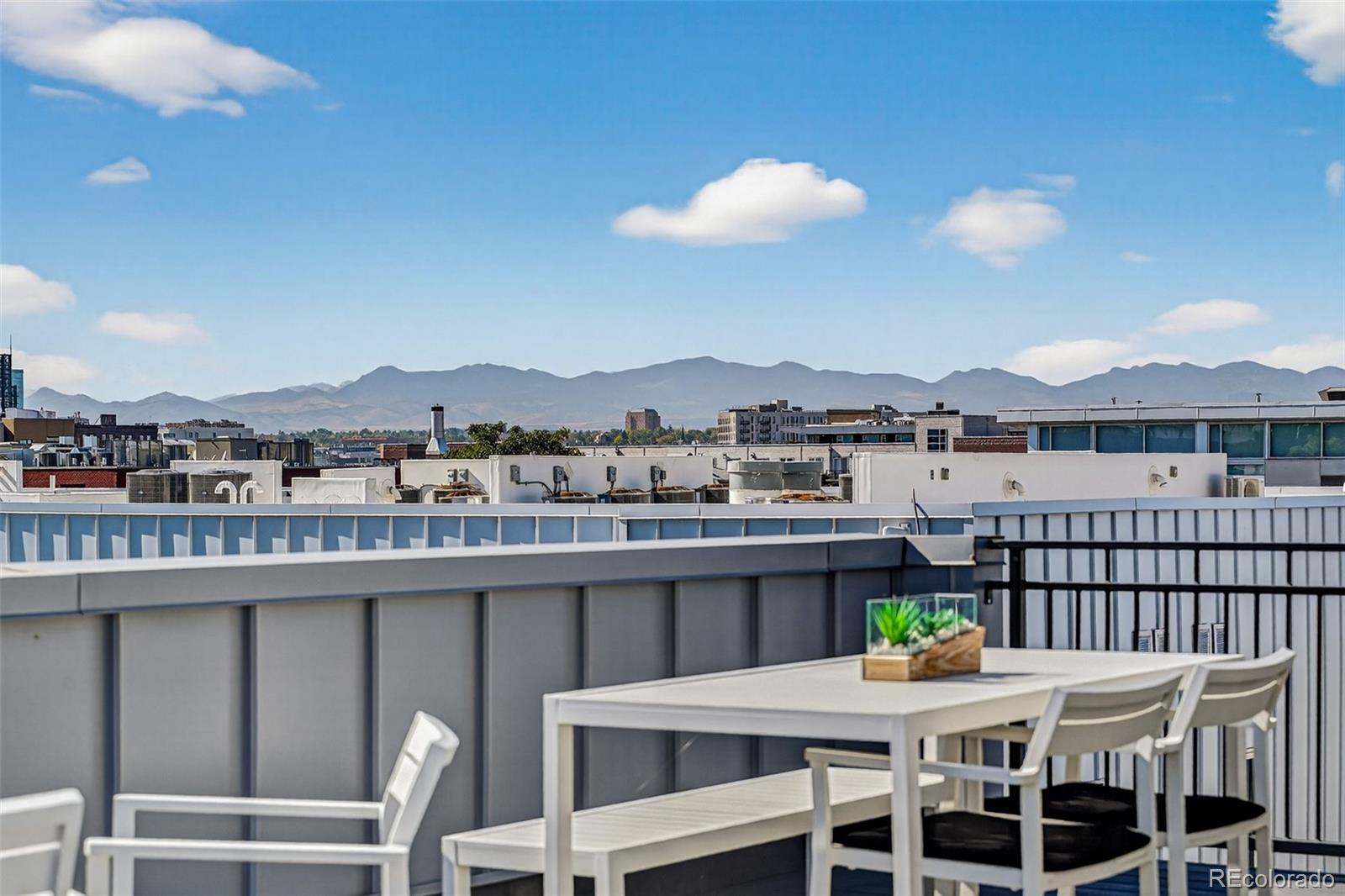 1150 26th Street Denver, CO 80205 - Photo 41 of 50 a view of a balcony dining table and chairs