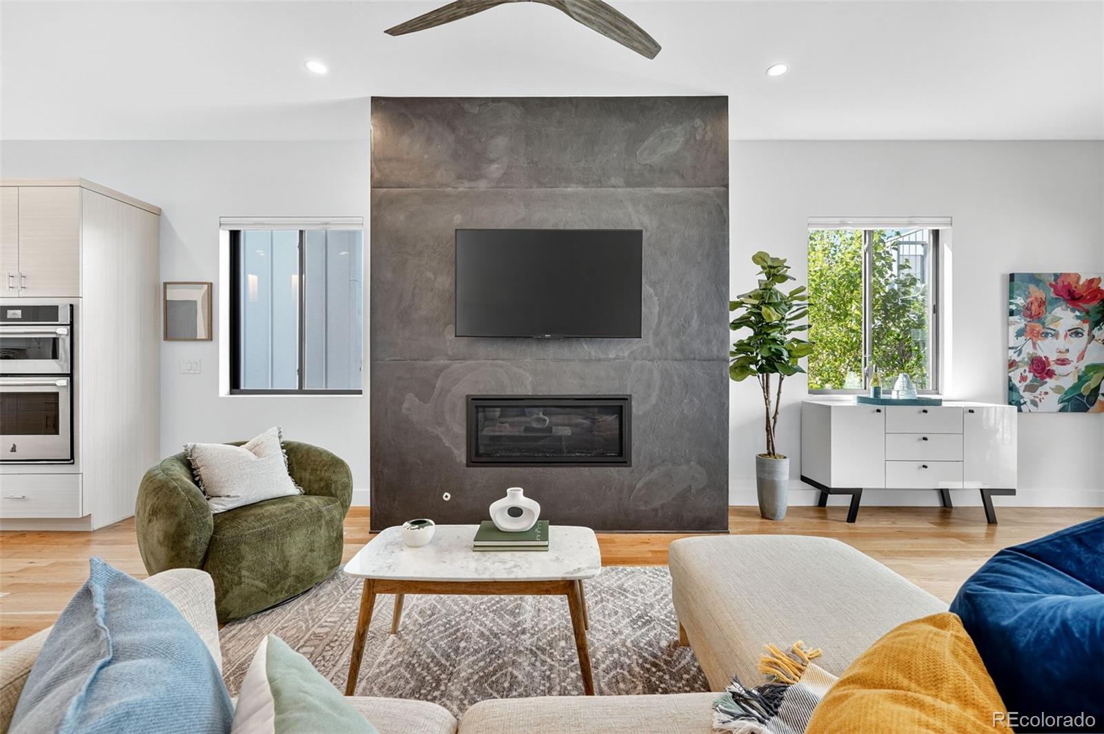 1150 26th Street Denver, CO 80205 - Photo 10 of 50 a living room with furniture and a fireplace