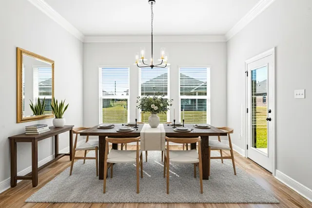 a view of a dining room with furniture window and outside view