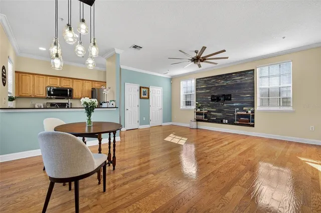 a view of kitchen with microwave and cabinets