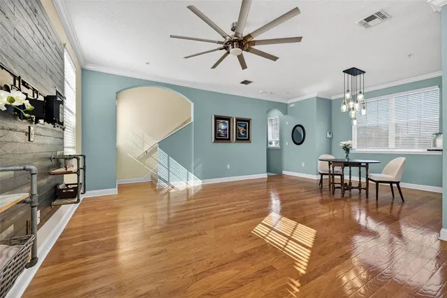 a view of a livingroom with furniture and a dining table
