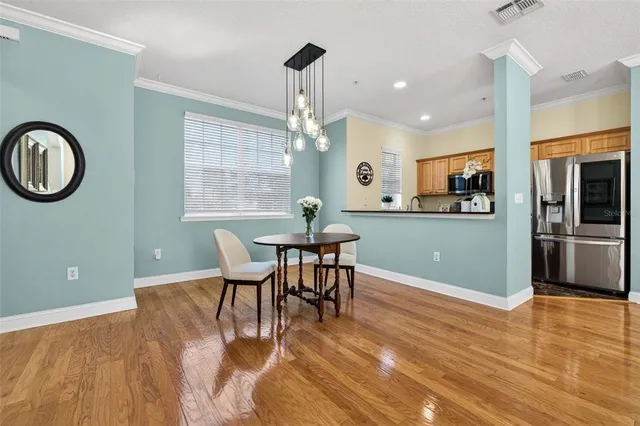 a kitchen with a table chairs and microwave
