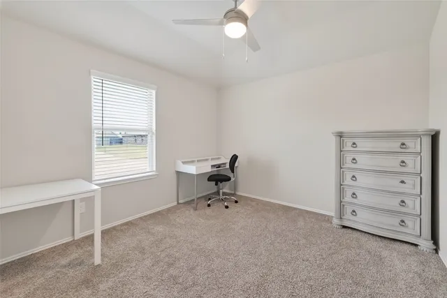 a view of a bedroom with cabinet cabinet and a window
