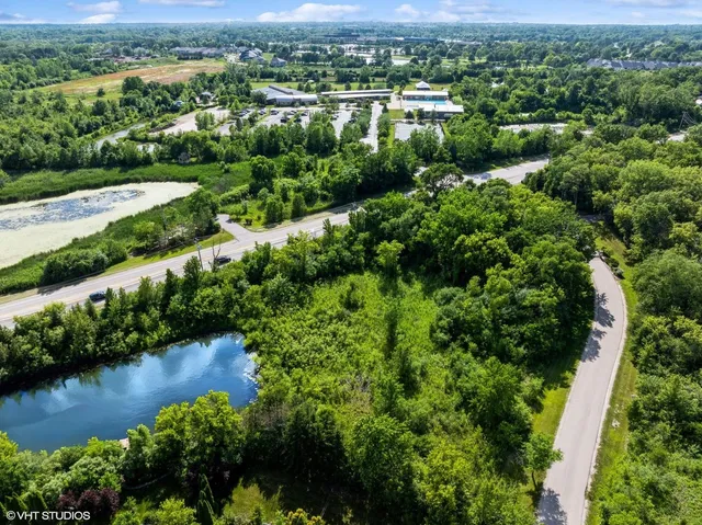 an aerial view of a yard with a garden