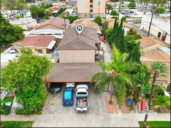an aerial view of a house with a yard
