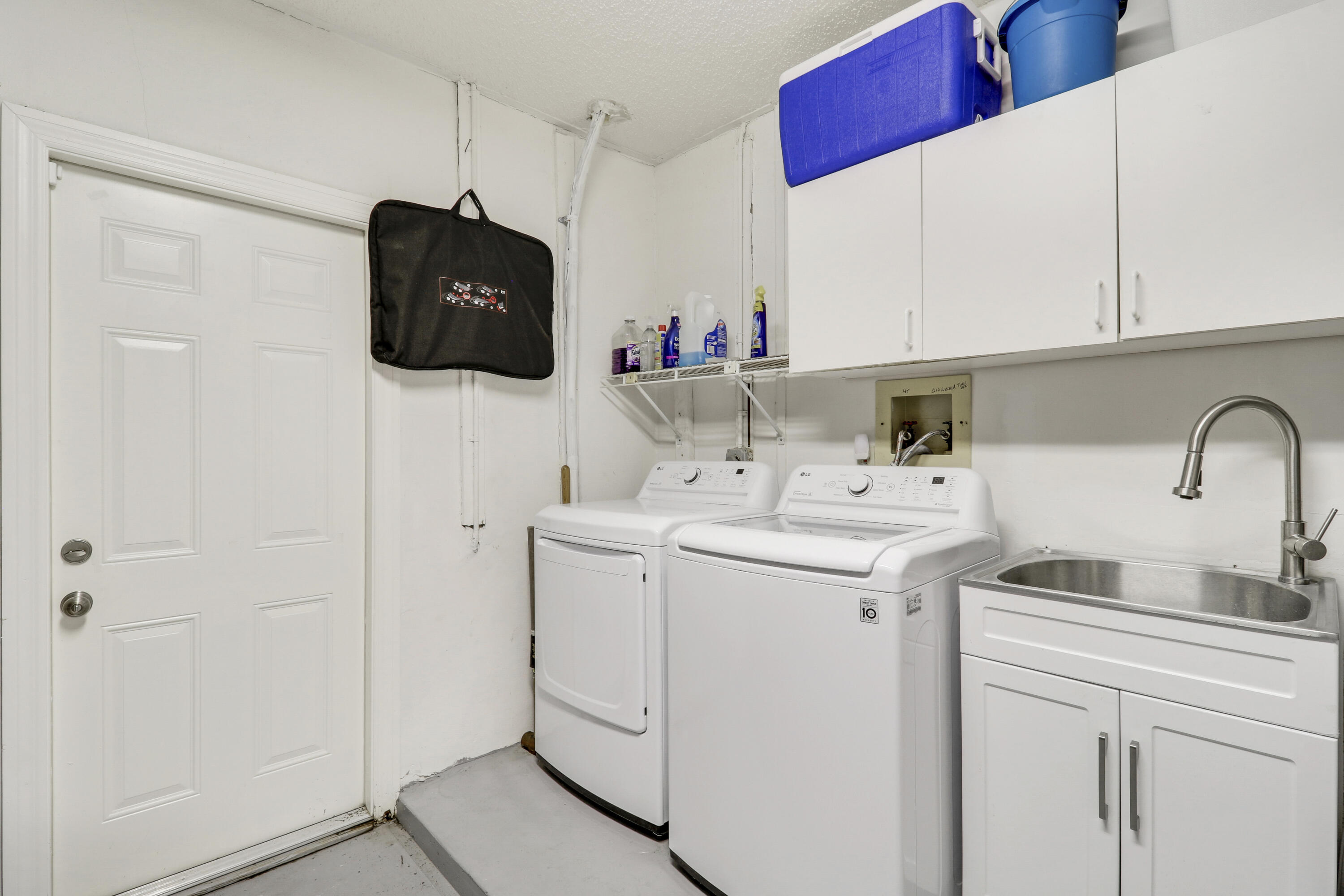 1472 Via Cameron Jupiter, FL 33477 - Photo 23 of 24 Garage with Utility Sink