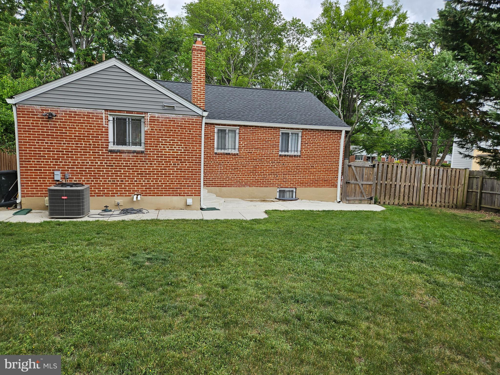 11102 Bucknell Drive Silver Spring, MD 20902 - Photo 13 of 14 a front view of a house with garden