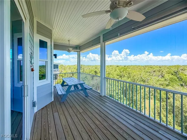 a view of two chairs in the balcony
