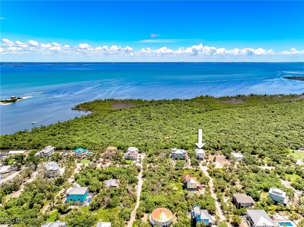 631 Rum Road Upper Captiva, FL 33924 - Photo 12 of 50 a view of an ocean from a yard