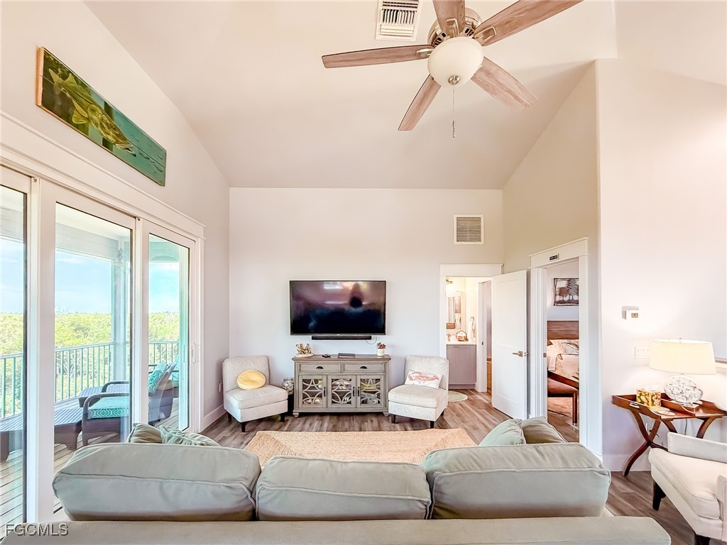 631 Rum Road Upper Captiva, FL 33924 - Photo 16 of 50 a living room with furniture and a flat screen tv